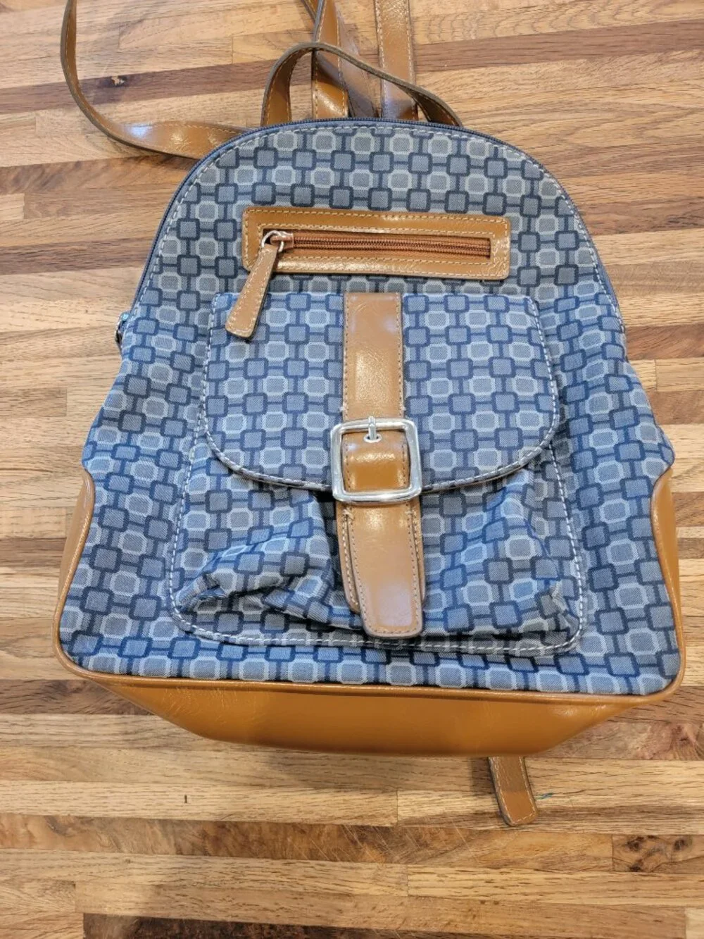 Nine West backpack purse featuring a geometric pattern and brown faux leather tr